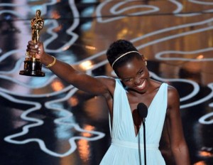 Lupita Nyong'o celebrates her Oscar win in Fred Leighton gold jewelry. (PRNewsFoto/LoveGold)