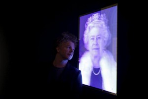 Artist Chris Levine poses next to his lenticular image of Britain's Queen Elizabeth during a press view at the National Portrait Gallery in London, Britain in this May 16, 2012 file photo. REUTERS/Stefan Wermuth/Files